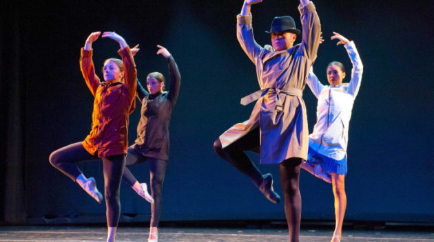 Group of dancers performing on stage