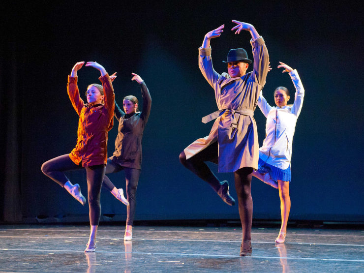 Group of dancers performing on stage