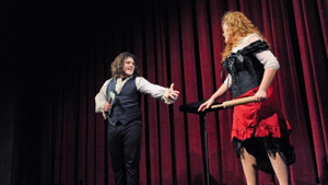 Two performers on stage together
