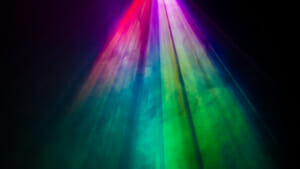 Colorful stage lights shining down on a stage