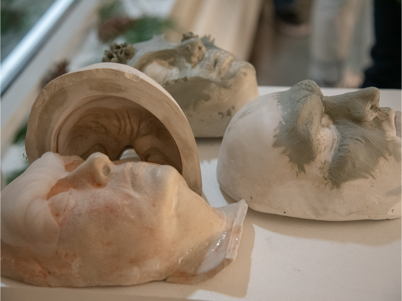 Plaster molds of faces with silicon effects on top of them