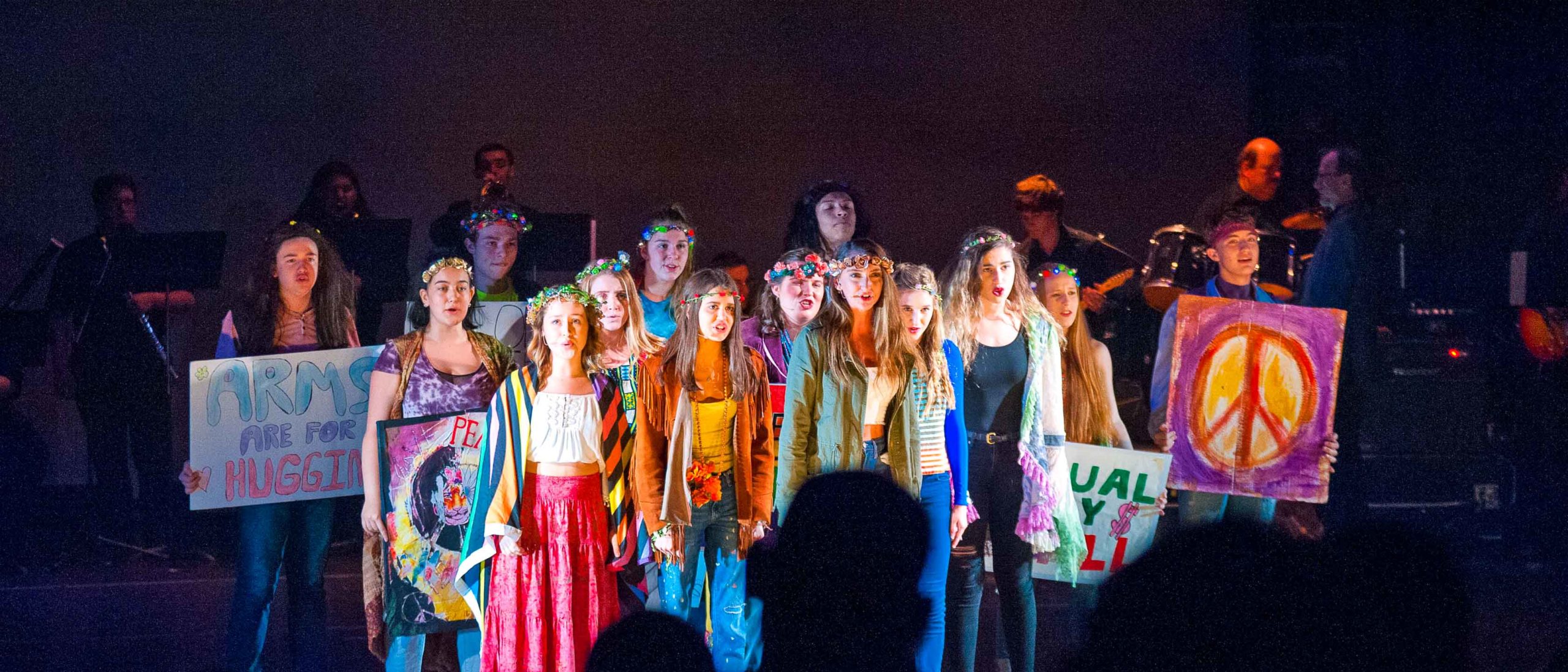 Girl students singing on stage
