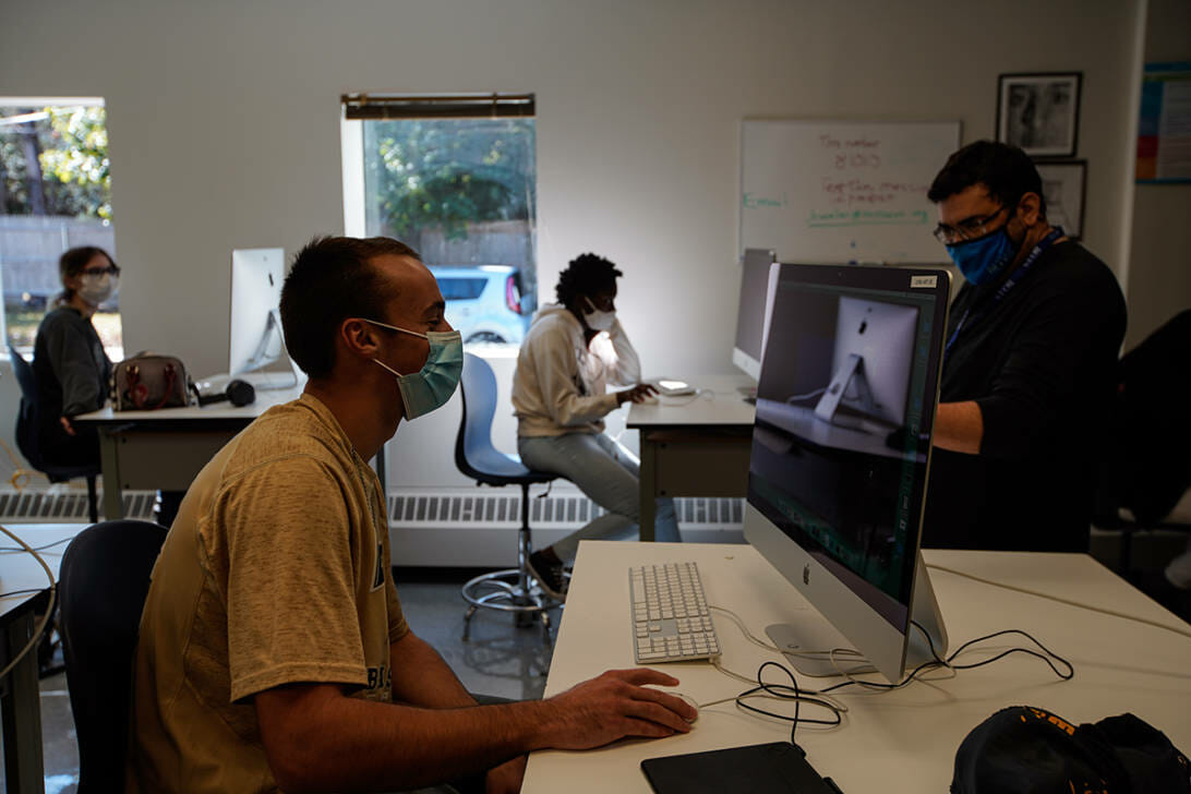 students using mac computers and social distancing