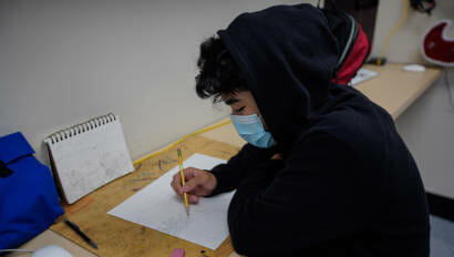 student practicing drawing