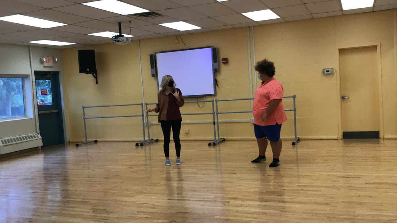 two woman in dance studio