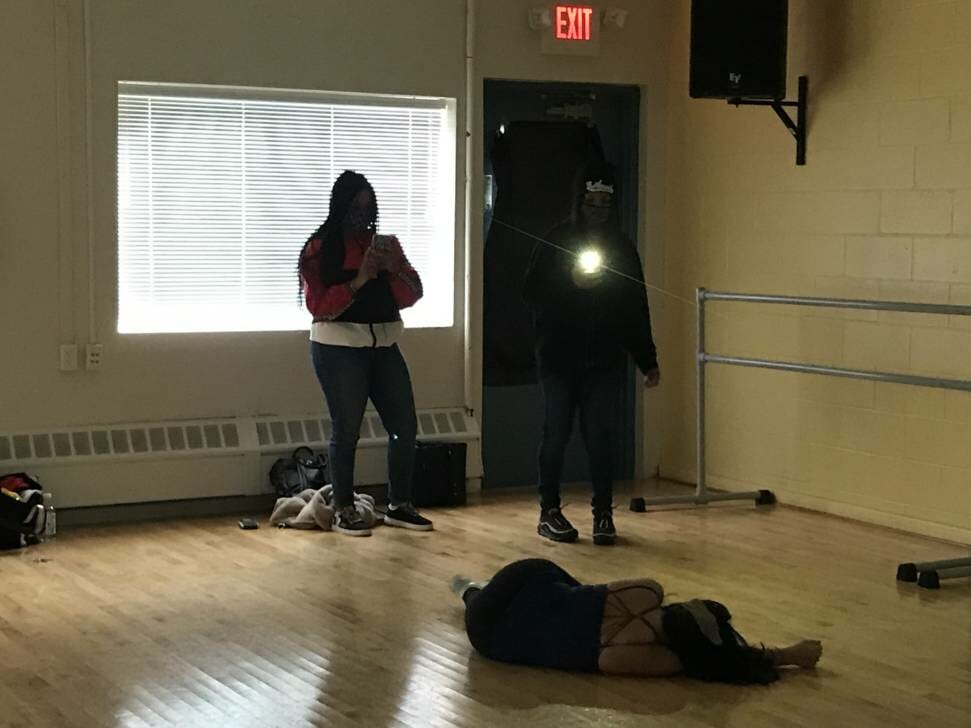 students taking photos of dance class