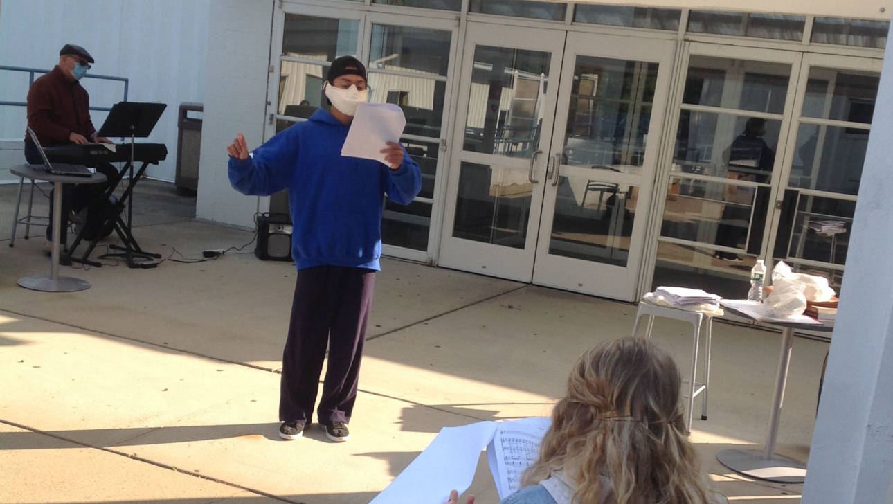 Performing Arts student singing in class outside