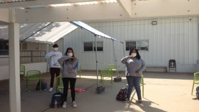 Performing Arts class singing warmup outside