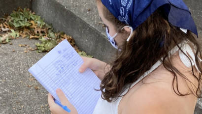 Production and Managerial Arts student looking at her notebook notes