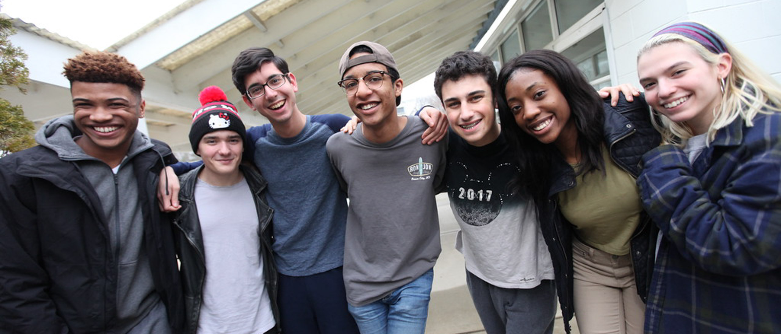 Group of students smiling and laughing together