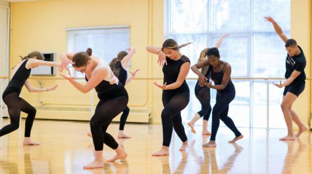 A group of dancers in the midst of a routine
