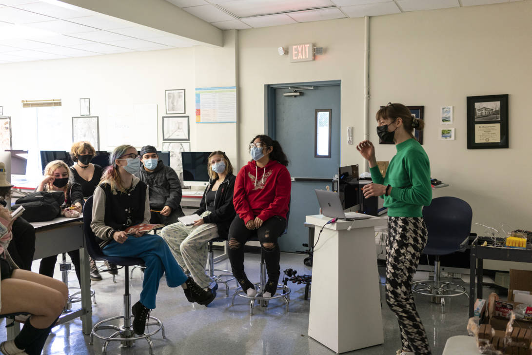 woman talking to a class of students