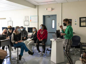 woman talking to a class of students