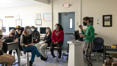 woman talking to a class of students