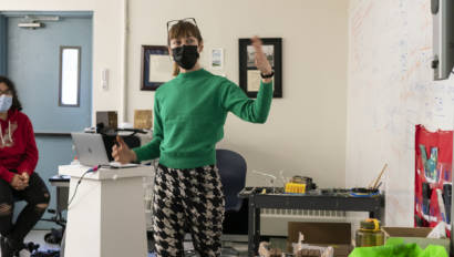 woman talking in an art classroom