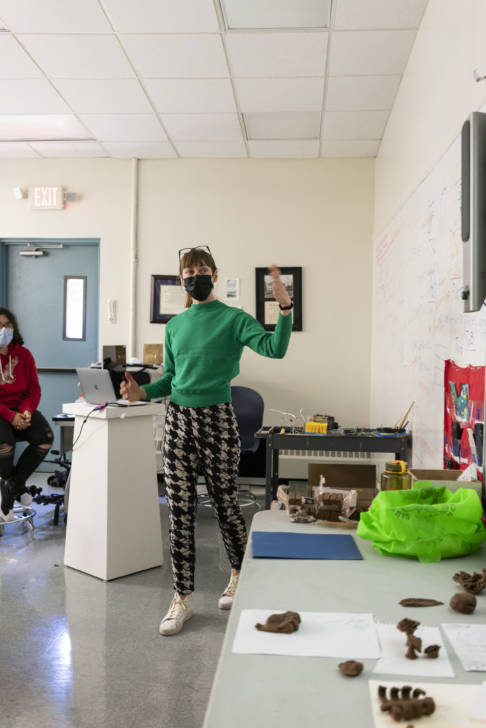 woman talking in an art classroom